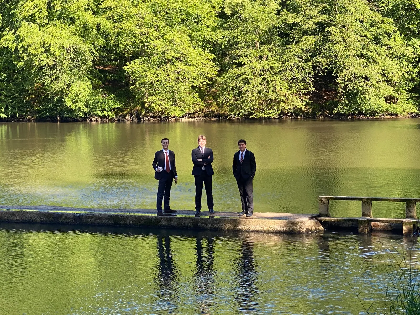 Choir members beside the water near Hirson